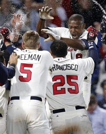 Justin Upton is doused by teammates after his walk-off home run. (AP Photo/Butch Dill)