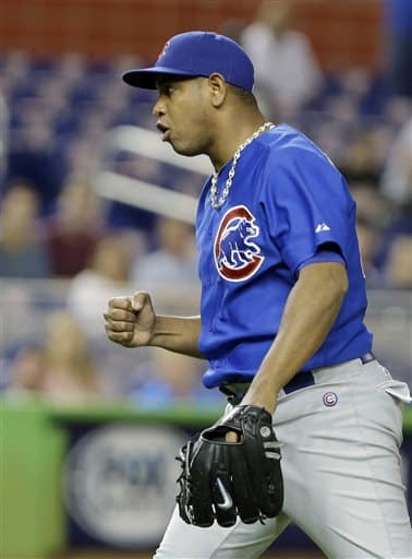Chicago Cubs relief pitcher Carlos Marmol celebrates as the Cubs defeated the Miami Marlins 4-3 in a baseball game, Thursday, April 25, 2013 in Miami. (AP Photo/Wilfredo Lee)