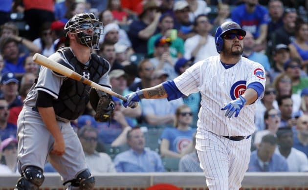 Navarro leaves yard three times, Feldman feeling it in North Siders' 9-3 win over Sox 1 AP photo, Charles Rex Arbogast