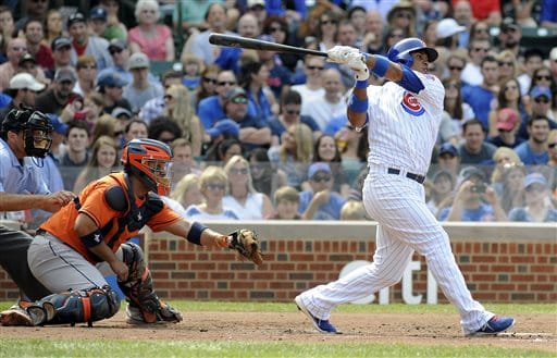 Controversial Call Gives Astros the Win Over the Cubs 1 Chicago Cubs' Luis Valbuena, right, hits a two-run single during the third inning of a baseball game against the Houston Astros, Saturday, June 22, 2013, in Chicago, Ill. Astros catcher Carlos Corporan, center, looks on. (AP photo/Joe Raymond)