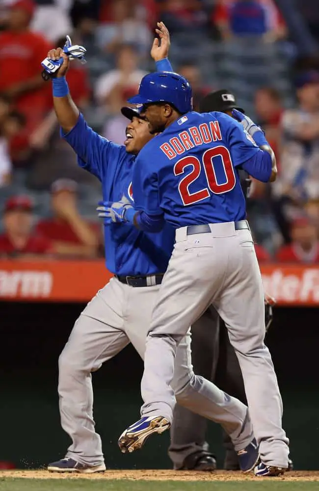 Rizzo Gives Cubs the Win in Extras, 8-6 the Final 1 Luis Valbuena (L) #24 and Julio Borbon #20 of the Chicago Cubs celebrate as they score on a hit by Anthony Rizzo (not pictured) against the Los Angeles Angels of Anaheim in the tenth inning at Angel Stadium of Anaheim on June 5, 2013 in Anaheim, California. The Cubs defeated the Angels 8-6 in ten innings. (Photo by Jeff Gross/Getty Images)