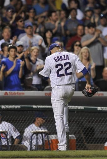 Cubs Take Another From Cardinals in Possible Cubs Finale for Garza 1 Chicago Cubs starting pitcher Matt Garza walks off the field after being pulled during the seventh inning of a baseball game against the St. Louis Cardinals in Chicago, Saturday, July 13, 2013. Chicago won 6-4. (AP Photo/Paul Beaty)