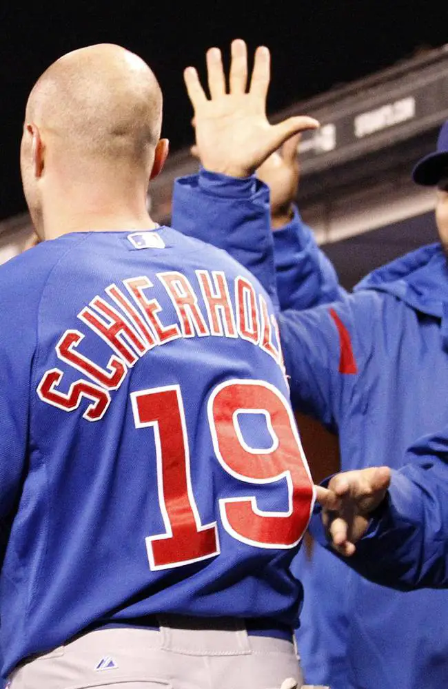 Belt's Gaffe Leads to Cubs 3-2 Win 1 Chicago Cubs' Nate Schierholtz, right, is congratulated by teammates after scoring a run on a single Starlin Castro against San Francisco Giants during the sixth inning of a baseball game on Friday, July 26, 2013, in San Francisco. (AP Photo/Tony Avelar)