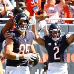 Chicago Bears players Cole Kmet and DJ Moore celebrate after a score