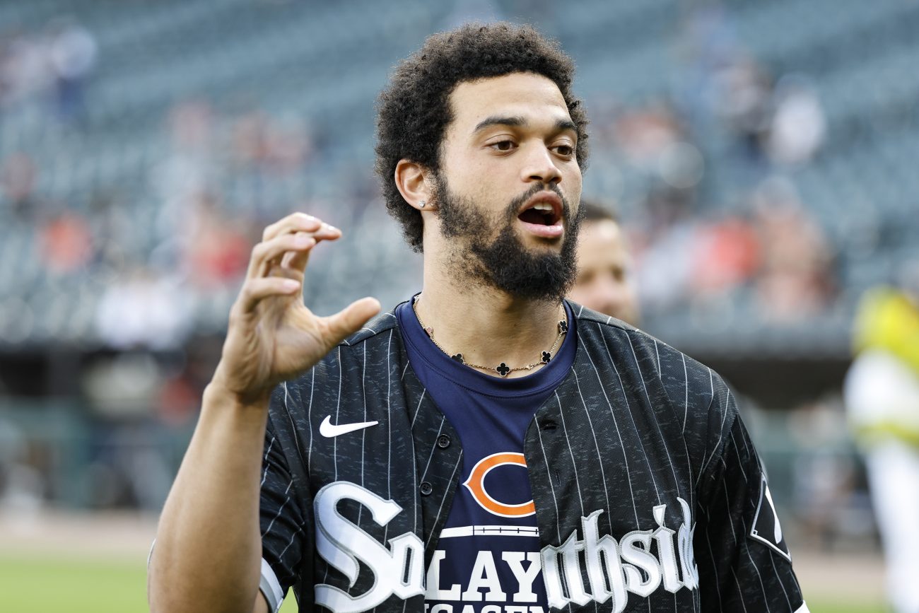 Chicago Bears quarterback Caleb Williams does the bear claw while attending a Chicago White Sox game.
