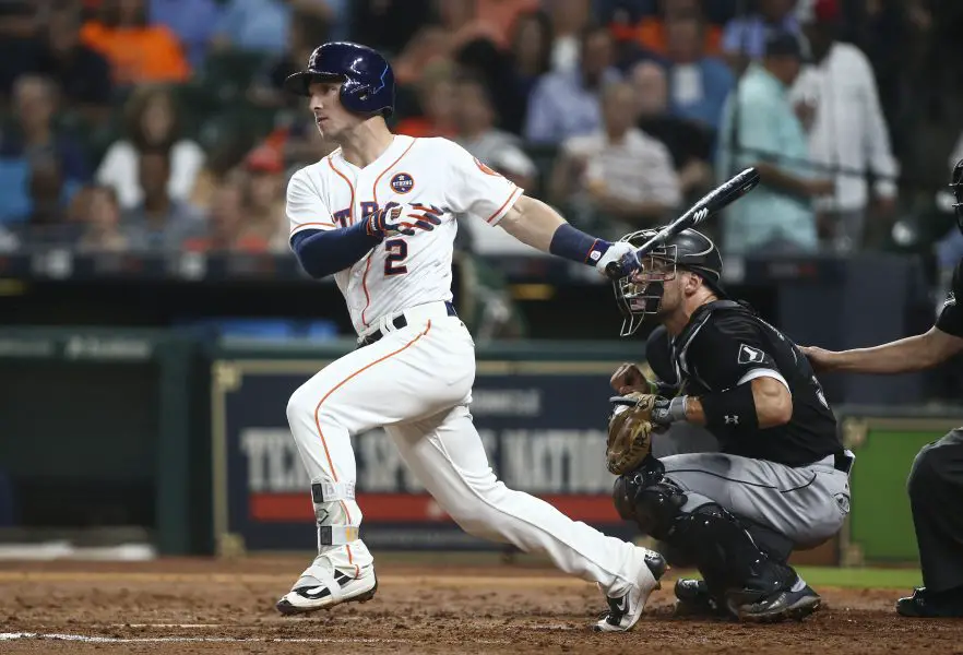 Houston Astros third baseman Alex Bregman (2) hits an RBI double during the fourth inning against the Chicago White Sox at Minute Maid Park. Mandatory Credit: Troy Taormina-Imagn Images