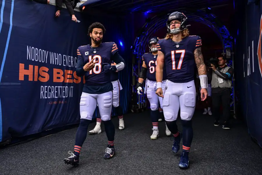 Chicago Bears quarterback Caleb Williams (18) and quarterback Tyson Bagent (17) enter the field before the game against the Green Bay Packers at Soldier Field.