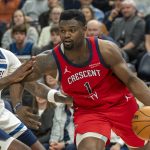New Orleans Pelicans forward Zion Williamson (1) drives to the basket past Minnesota Timberwolves center Naz Reid (11) in the second half at Target Center.