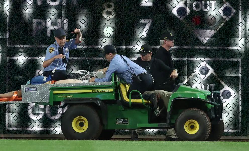 MLB: Chicago Cubs at Pittsburgh Pirates Stadium security and Pittsburgh Pirates medical personnel cart a fan who fell from the stands to the field to an ambulance as the Pirates batted against the Chicago Cubs during the seventh inningat PNC Park.