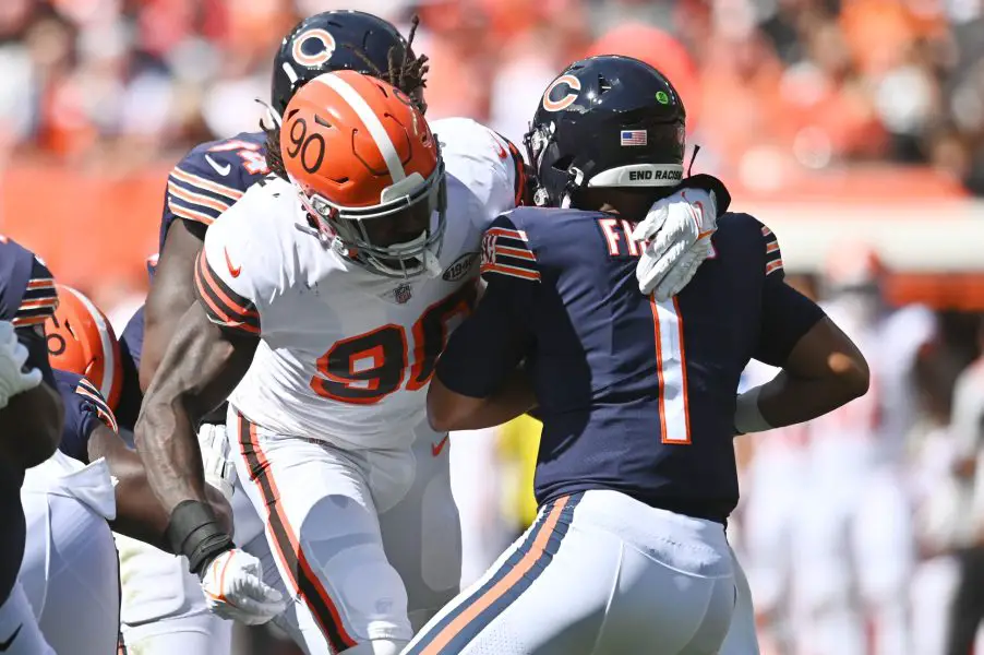 NFL: Chicago Bears at Cleveland Browns Cleveland Browns defensive end Jadeveon Clowney (90) sacks Chicago Bears quarterback Justin Fields (1) during the first quarter at FirstEnergy Stadium.