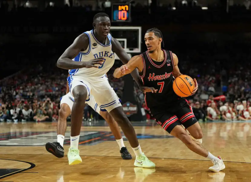 NCAA Basketball: Final Four National Semifinal Houston at Duke Houston Cougars guard Milos Uzan (7) dribbles the ball against Duke Blue Devils center Khaman Maluach (9) during the first half in the semifinals of the men's Final Four of the 2025 NCAA Tournament at the Alamodome.