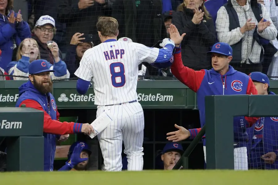 Chicago Cubs outfielder Ian Happ (8) is greeted by manager Craig Counsell (11) after hitting a two-run home run against the San Francisco Giants during the third inning at Wrigley Field