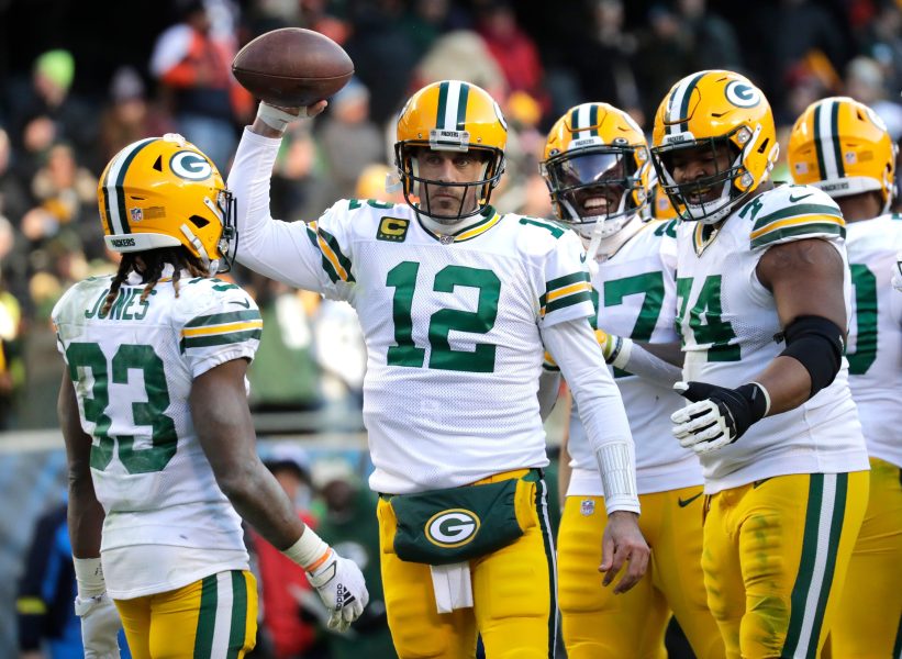 Syndication: The Post Crescent Green Bay Packers quarterback Aaron Rodgers (12) raises the ball in victory after taking a knee to end the game against the Chicago Bears during their football game Sunday, December 4, at Soldier Field in Chicago, Ill.