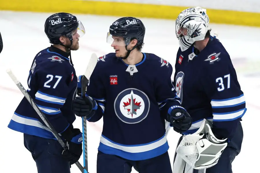 NHL: Stanley Cup Playoffs Dallas Stars at Winnipeg Jets Winnipeg Jets left wing Nikolaj Ehlers (27) , Winnipeg Jets center Morgan Barron (36) and Winnipeg Jets goaltender Connor Hellebuyck (37) celebrate their victory over the Dallas Stars in game two of the second round of the 2025 Stanley Cup Playoffs at Canada Life Centre.