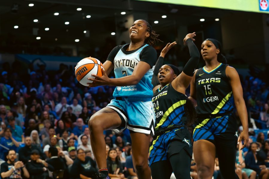 Chicago Sky guard Ariel Atkins (7) scores a layup ahead of Dallas Wings guard Arike Ogunbowale (24) during the first half at College Park Center. 