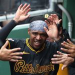 Potential Chicago Cubs target and Pittsburgh Pirates third baseman Ke'Bryan Hayes (13) high-fives in the dugout after scoring a run against the Philadelphia Phillies