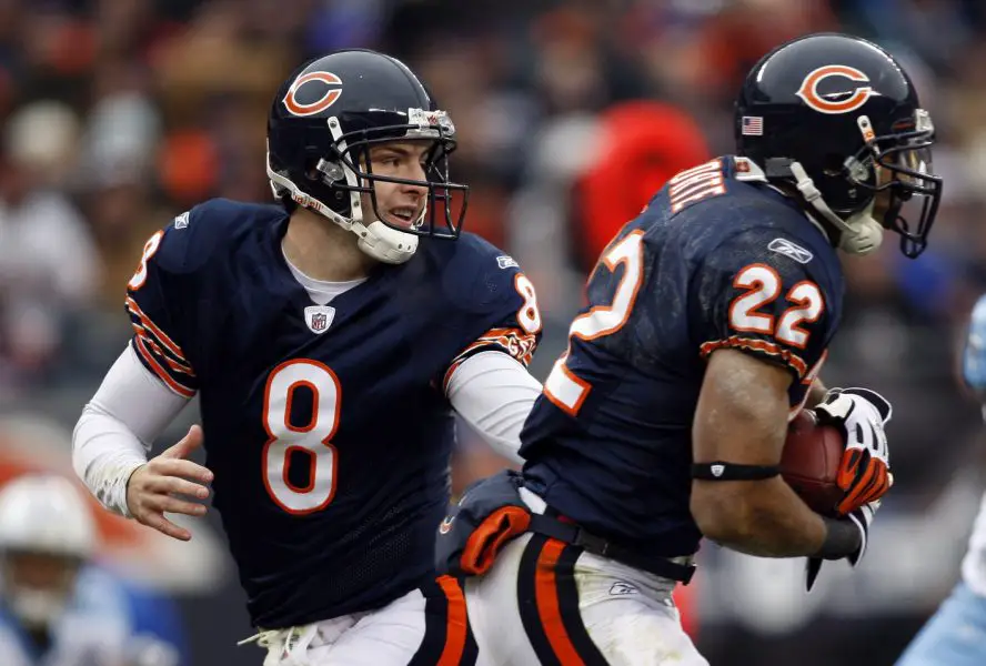 Chicago Bears quarterback Rex Grossman (8) hands the ball off to running back Matt Forte (22) during the second quarter against the Tennessee Titans at Soldier Field. The Titans beat the Bears 21-14. 