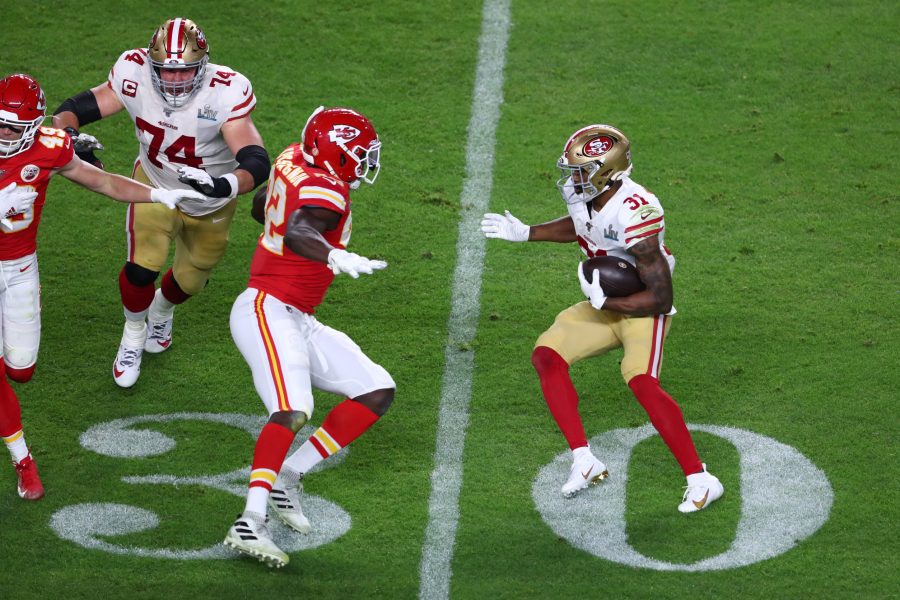 NFL: Super Bowl LIV San Francisco 49ers vs Kansas City Chiefs San Francisco 49ers running back Raheem Mostert (31) tries to avoid Kansas City Chiefs defensive end Tanoh Kpassagnon (92) in Super Bowl LIV at Hard Rock Stadium.