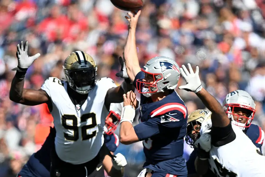 NFL: New Orleans Saints at New England Patriots New England Patriots quarterback Mac Jones (10) throws under pressure from New Orleans Saints defensive end Tanoh Kpassagnon (92) during the first half at Gillette Stadium.