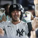 New York Yankees center fielder Cody Bellinger (35) is greeted in the dugout after hitting a two run home run, his third home run of the game, in the eighth inning against the Chicago Cubs at Yankee Stadium.