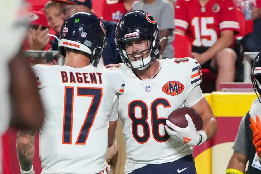 Chicago Bears tight end Joel Wilson (86) celebrate with quarterback Tyson Bagent (17) after scoring against the Kansas City Chiefs during the second half of the game at GEHA Field at Arrowhead Stadium. 
